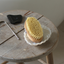 Image of Dry skin brush on a stool alongside the Gua Sha Bian Stone and Tongue cleaner